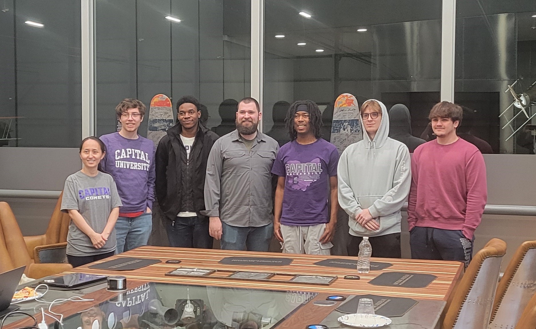 A group of students from Capital University pose in the museum's Centennial Boardroom.