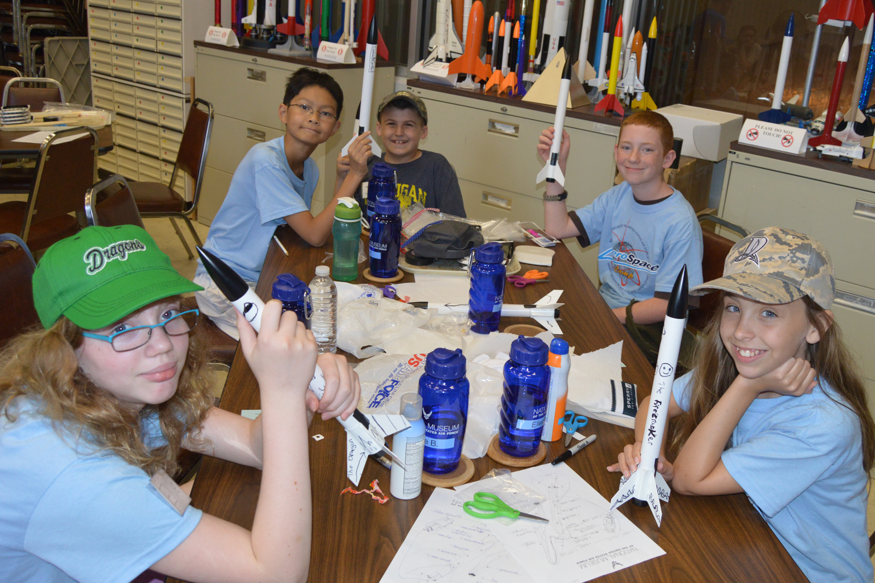 Students in the Summer Rocketry Camp display their model rockets