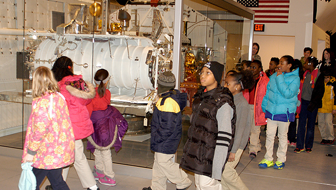 Group of students touring the Space Shuttle Exhibit Group of students touring the Space Shuttle Exhibit